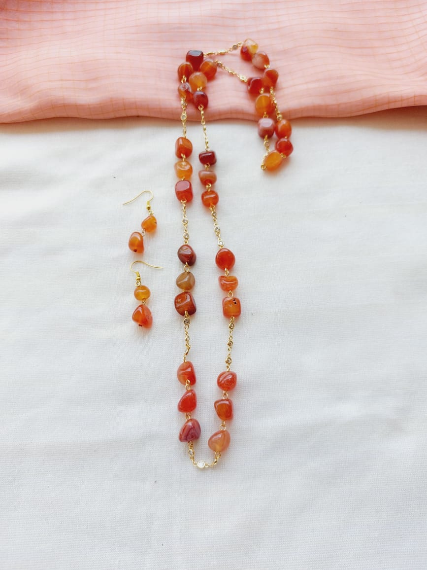 Vibrant Orange Glass Beads American Diamond Set on White Fabric