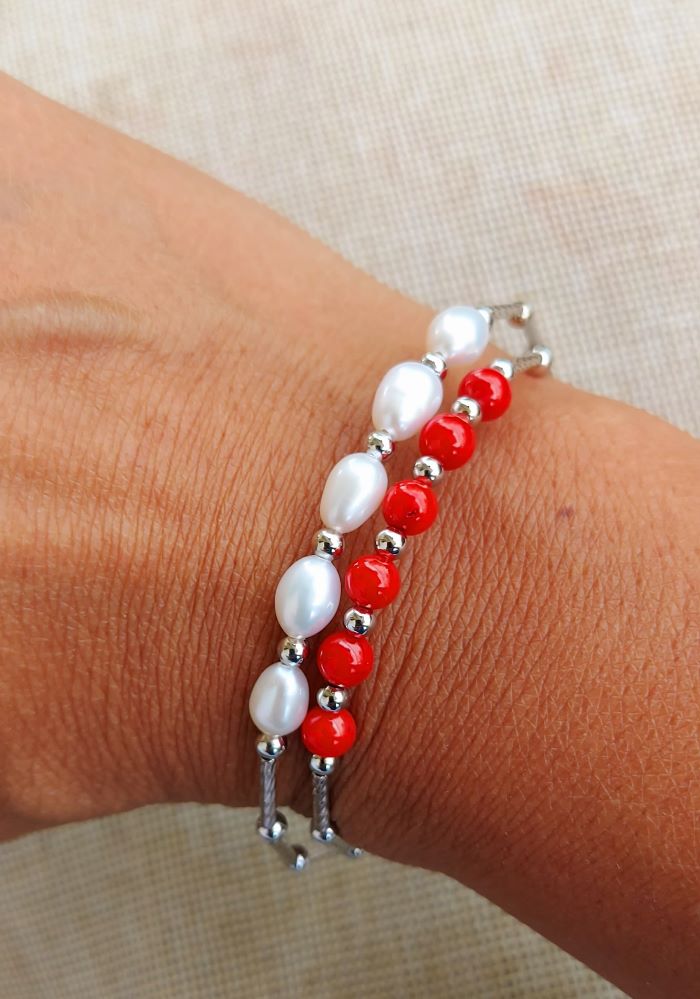 Pearl and Coral Designer Bracelet
This image depicts a stylish bracelet featuring a combination of shimmering pearls and vibrant coral beads. The bracelet is arranged in a delicate and visually appealing design, showcasing the natural beauty of the materials used.
