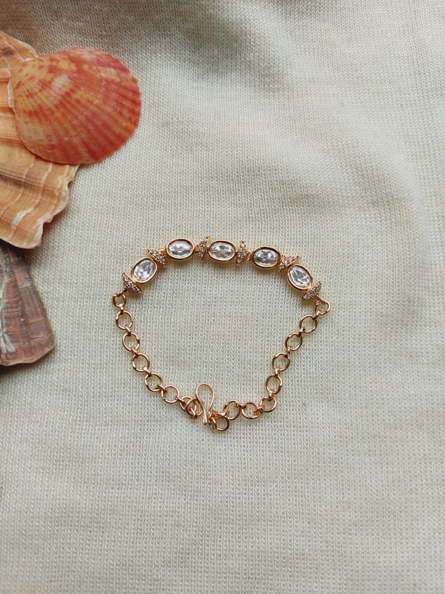 Elegant oval kundan bracelet adorned with shimmering stones in a Mugdha Jewellery Store product placement.