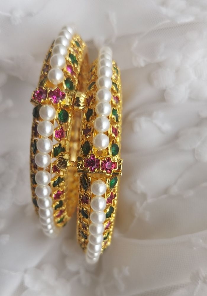 Elegant multicolored pearl and gold-tone tode bangles with floral accents, available in size 2 by 6 from Mugdha Jewellery Store.