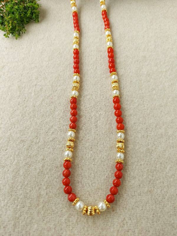 Coral Pearl Chain - Elegant red coral and gleaming golden beads create a striking necklace from Mugdha Jewellery Store.