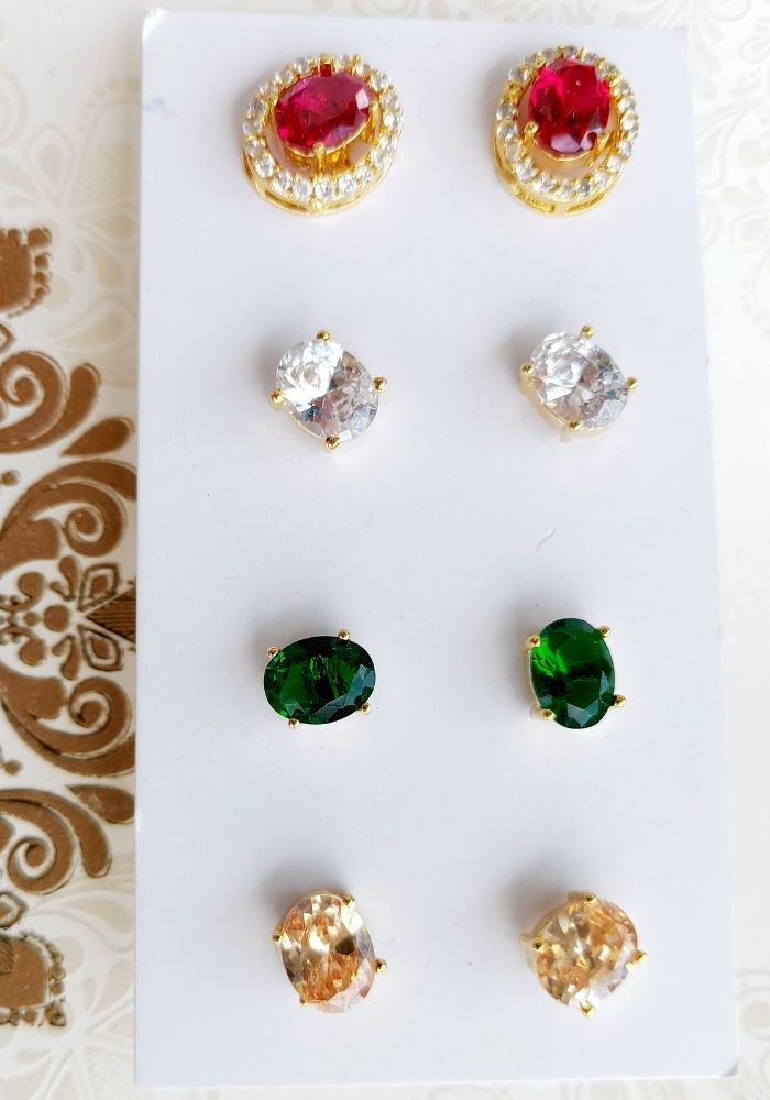 Oval Changeable Earrings 4 in 1 - Vibrant gem-encrusted stud earrings in various shapes and colors, displayed on a white background.