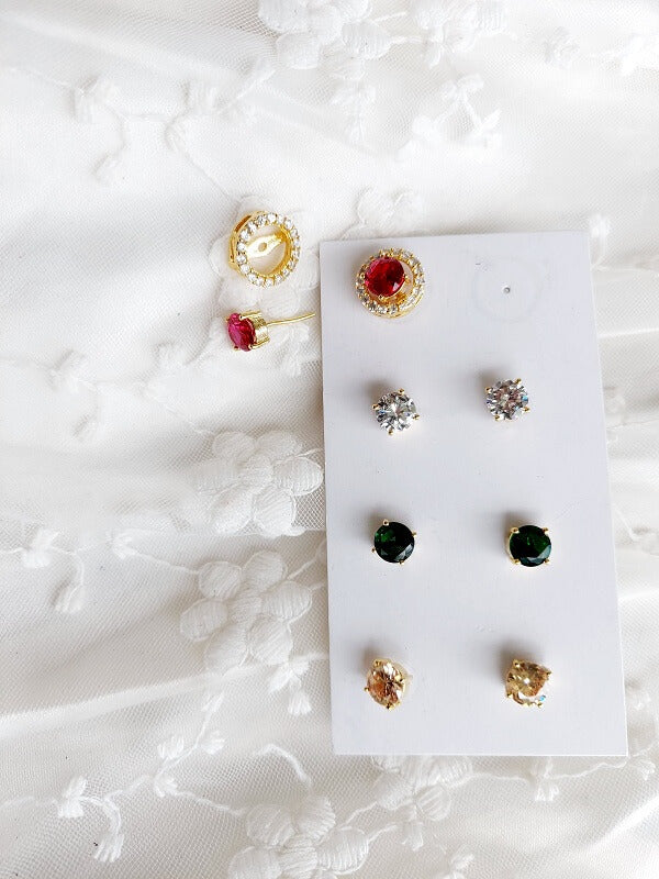Elegant changeable earrings in various colors and designs, displayed on a white background with lace accents.