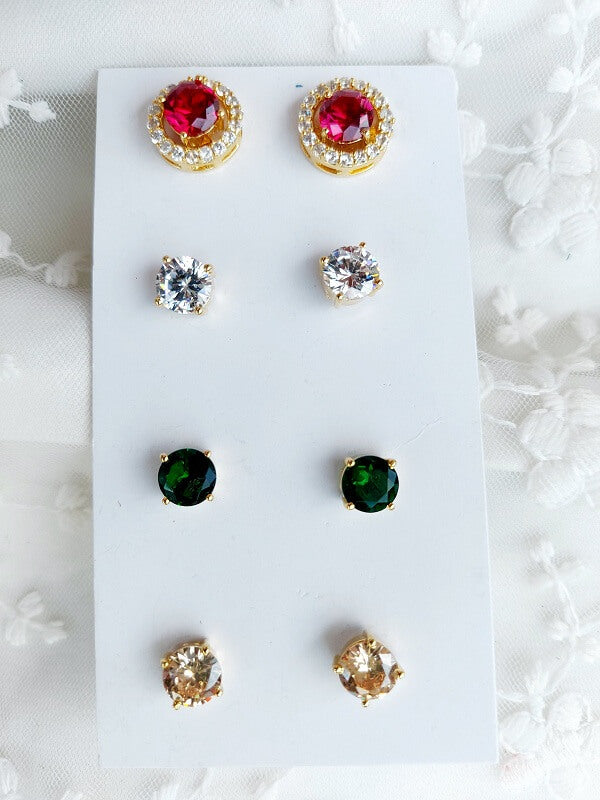Elegant changeable stud earrings featuring sparkling red, green, and clear stones set in a gold-tone metal on a white display.