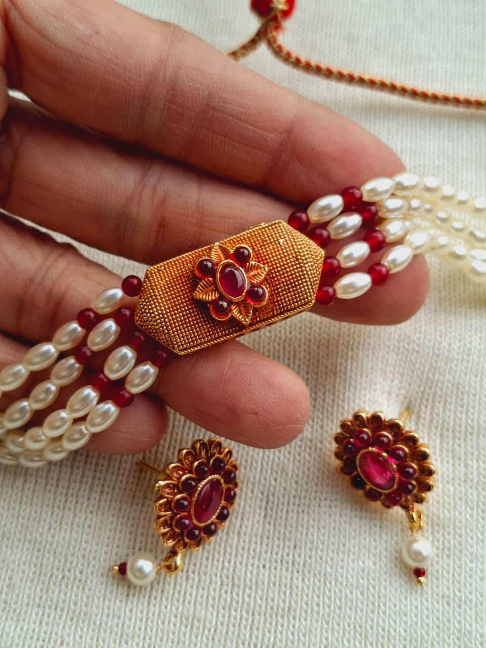 Rice Pearls Geru Designer Chocker - Elegant pearl and ruby necklace with floral clasp from Mugdha Jewellery Store.