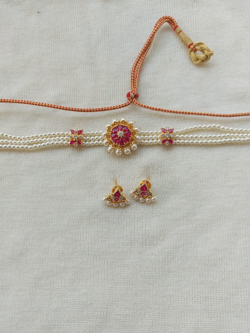 Elegant pearl choker with ruby embellishments from Mugdha Jewellery Store