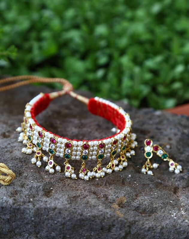 Traditional Multicoloured Beaded Gadi Chinchpeti Necklace on Stone Backdrop