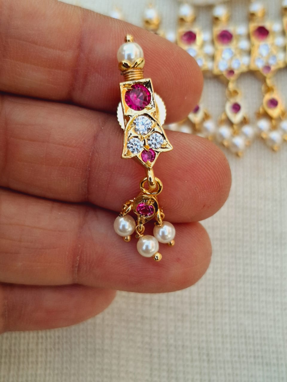 23 Patti 3 White Stone Rajwada Chinchpeti pendant, a stunning traditional Indian jewelry item featuring a central ruby stone surrounded by white crystals and hanging pearl accents.