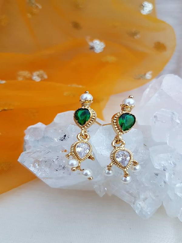 Elegant green and white heart-shaped gemstone earrings from Mugdha Jewellery Store, set in shimmering gold-toned metal.