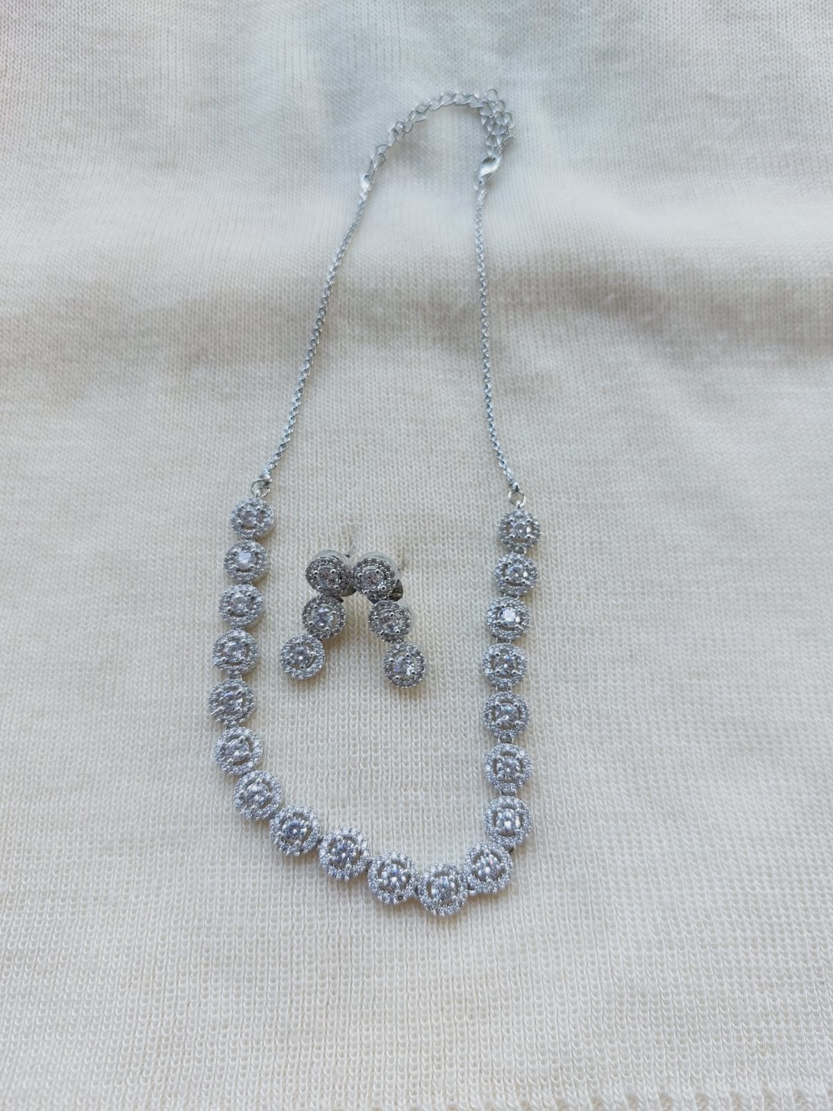 Elegant diamond necklace set with earrings, exquisite jewelry piece showcasing luxury and style.