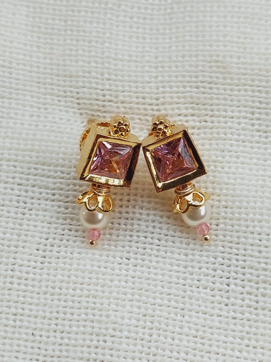 Ornate Gold-Tone Earrings with Purple Gemstones from Mugdha Jewellery Store