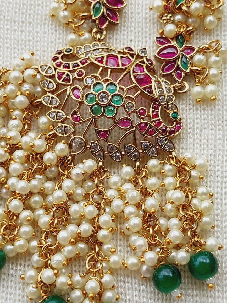 Maharani Designer Lotus Necklace with vibrant gemstones, pearls, and intricate gold-toned filigree design