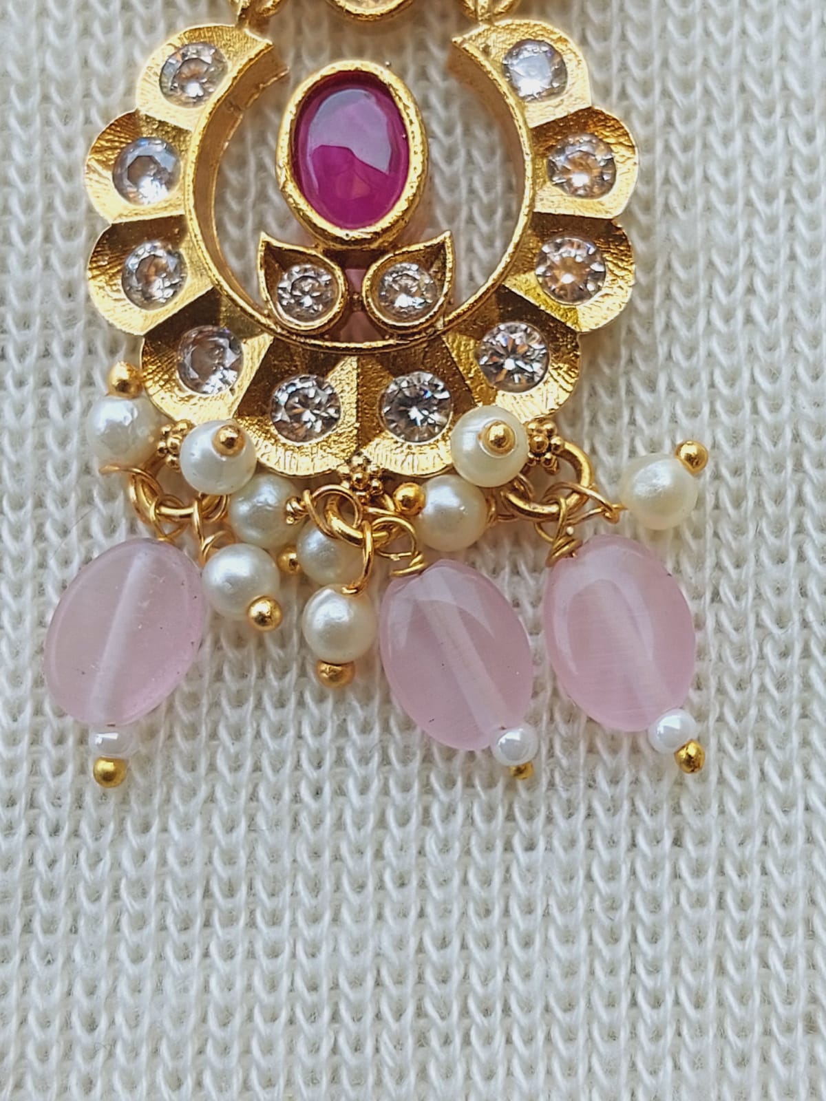 Designer Peacock Kundan Baby Pink Bead Set - Ornate gold-tone pendant with rubies, diamonds, and pearl accents.