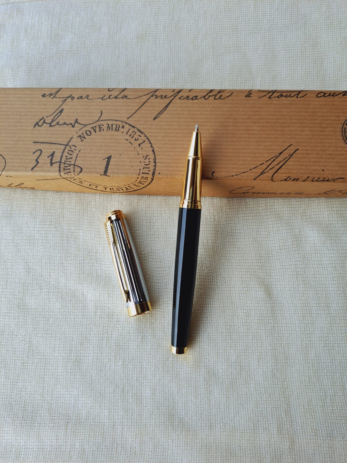 Elegant black fountain pen on vintage envelope with stamp