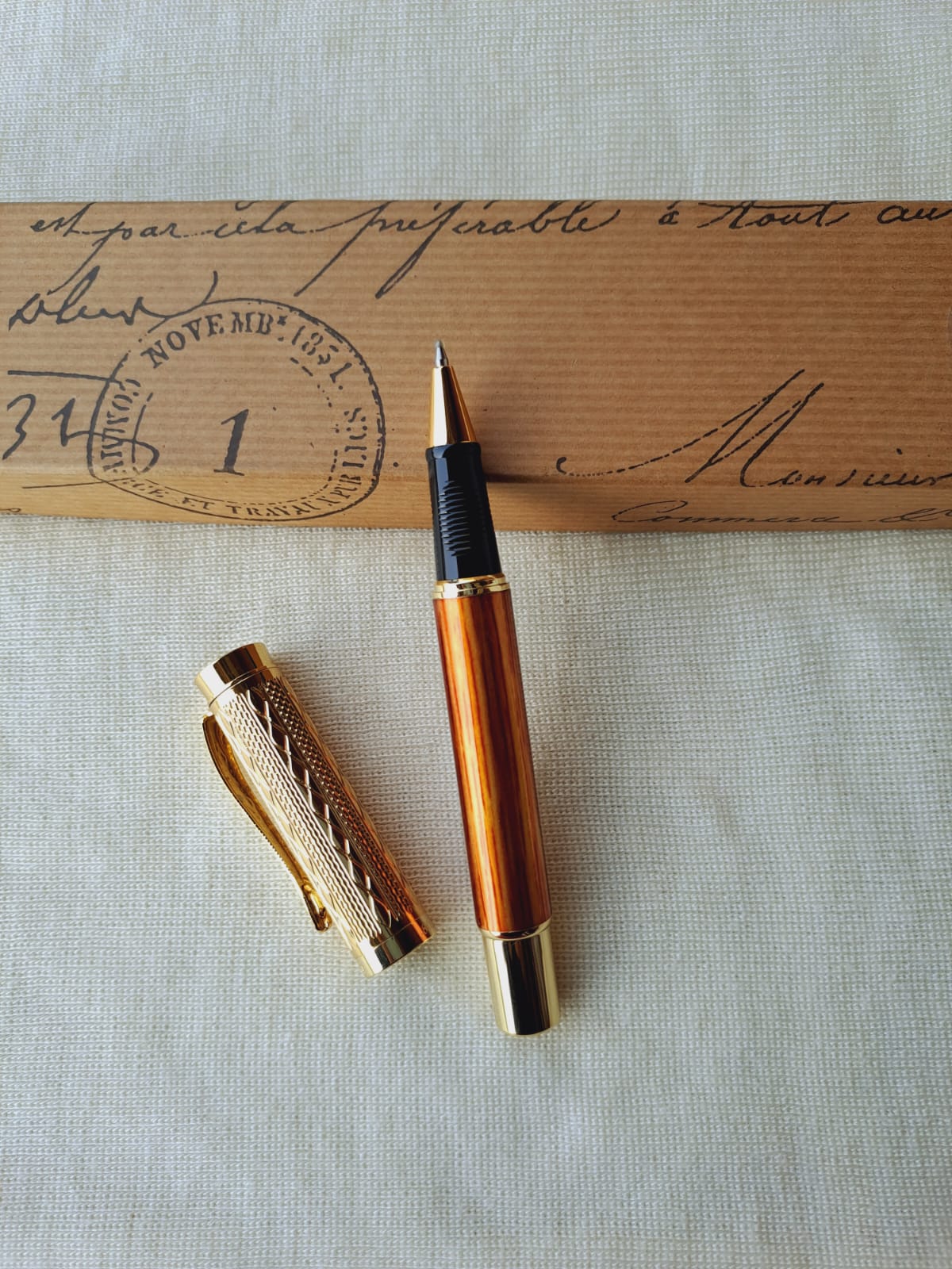 Elegant vintage fountain pen on antique envelope with postmark