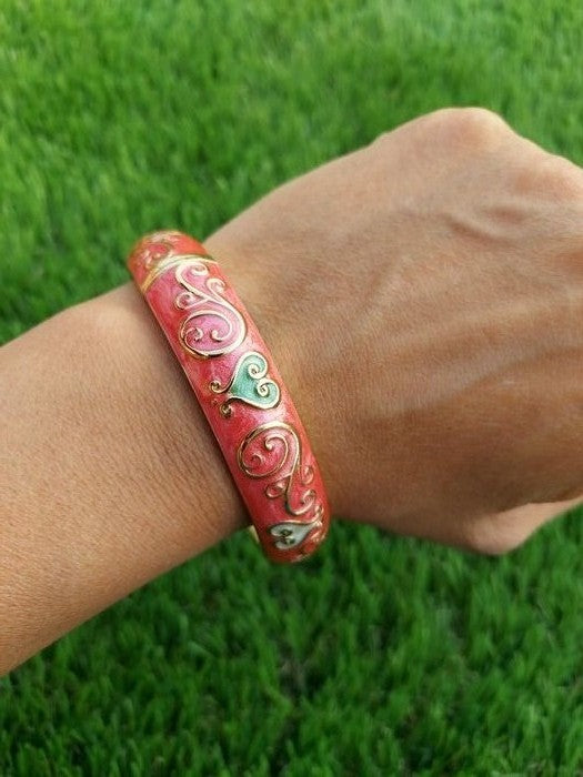 Vibrant Red Floral Kada Bracelet on Green Grass