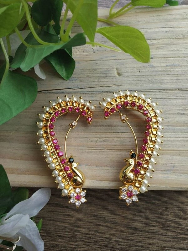 Elegant peacock-inspired gold and ruby earrings from Mugdha Jewellery Store