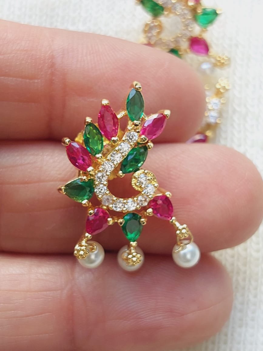 Multicoloured Designer Pendant Mangalsutra from Mugdha Jewellery Store featuring a vibrant floral design with ruby, emerald, and diamond accents.