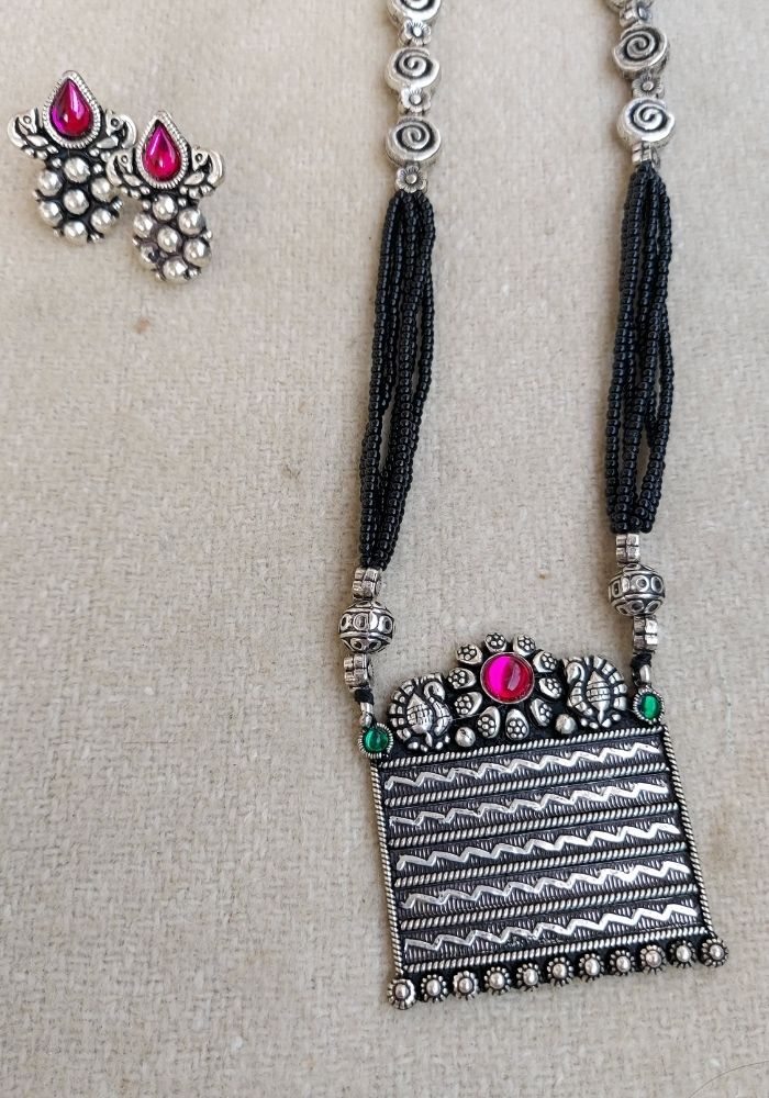 Square Pendant Designer Oxidised Long Mangalsutra - Exquisite gemstone-encrusted pendant with elegant geometric patterns, dangling chains, and intricate metalwork from Mugdha Jewellery Store.