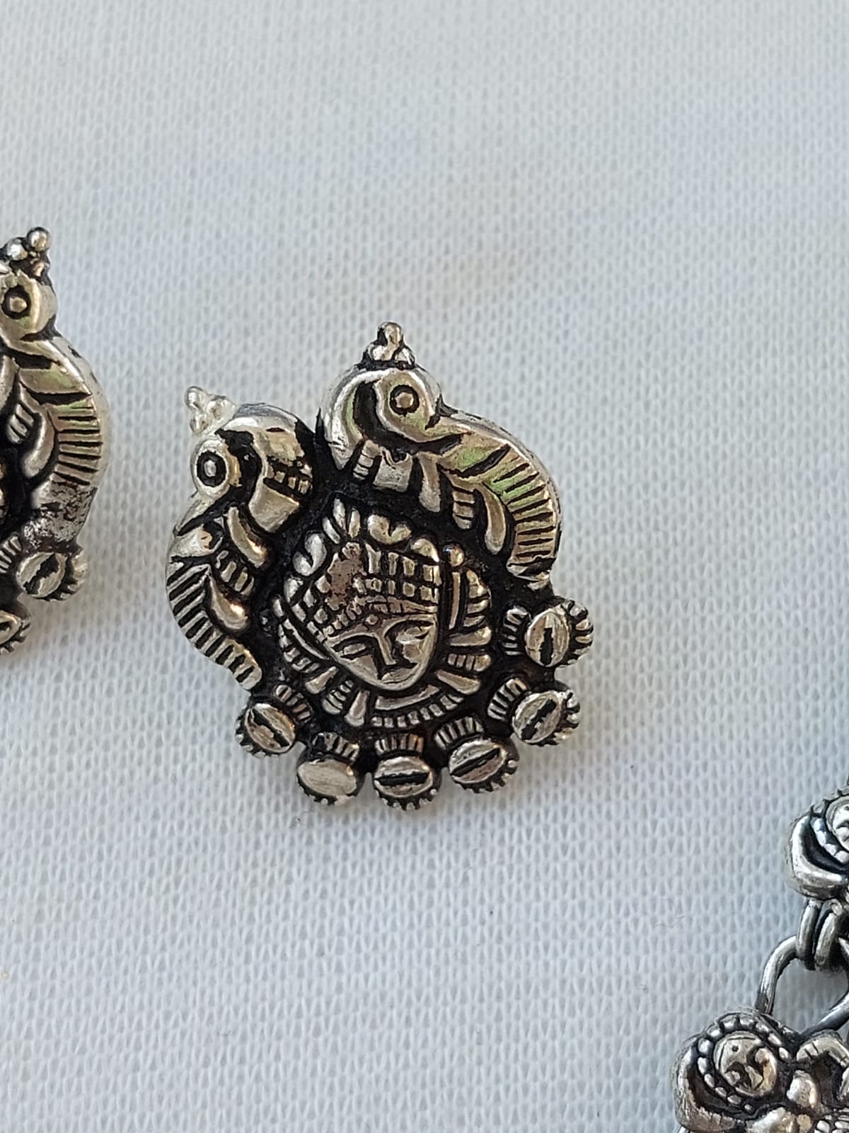 Oxidised Necklace Set - Intricate metal pendants with ornate, tribal-inspired designs displayed on a plain background.