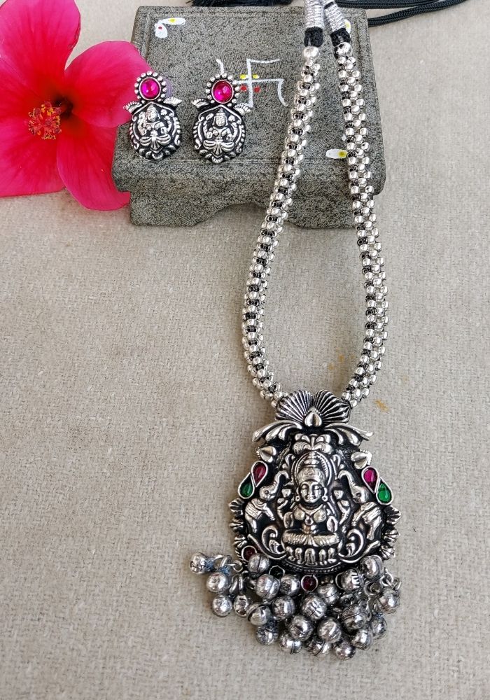 Intricate Oxidized Silver Necklace with Ganesha Pendant and Beaded Tassel, Accompanied by Matching Earrings