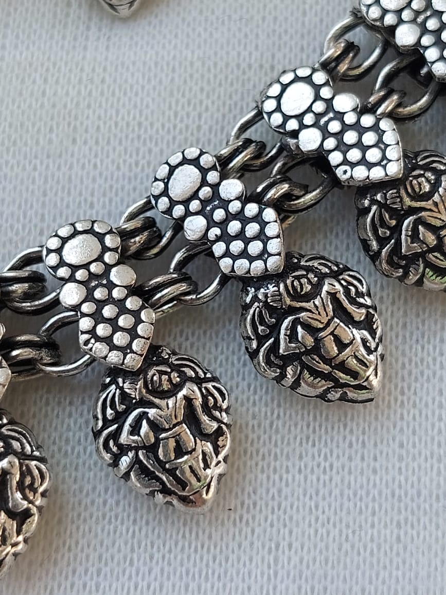 Oxidized Necklace Set with Intricate Floral Motifs and Beaded Details