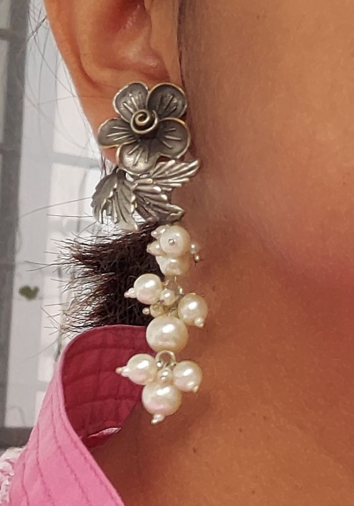 Elegant floral pearl earrings with silver accents