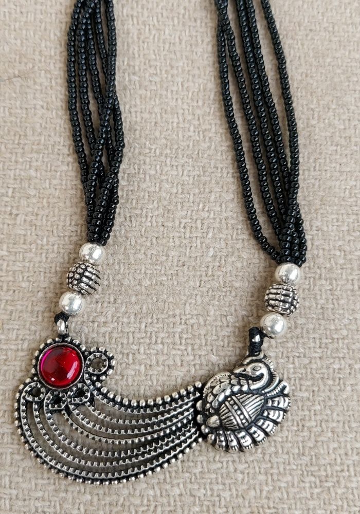 Oxidized Short Mangalsutra with Intricate Metal Detailing and Red Accent Stone