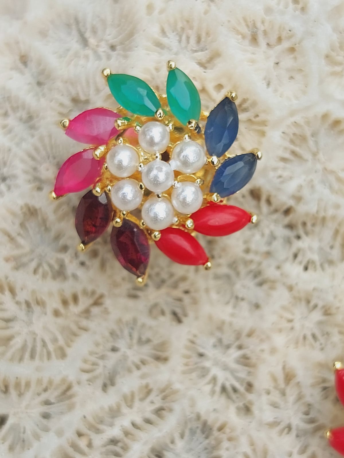 Vibrant Navaratna Pendant Set Without Chain - Multicolored gemstones, gold-toned metal, and lustrous pearls make this elegant pendant a standout piece.
