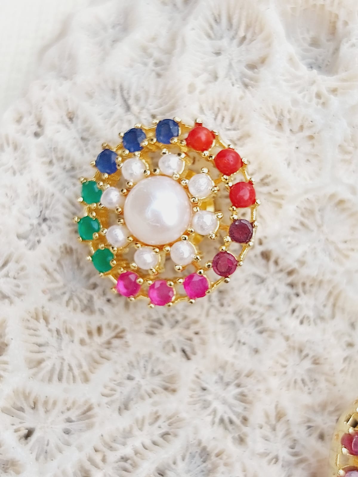 Colorful Navaratna Pendant Set without Chain
Stunning multicolored pendant featuring a central pearl surrounded by a radiant array of gemstones in shades of blue, green, red, and gold.