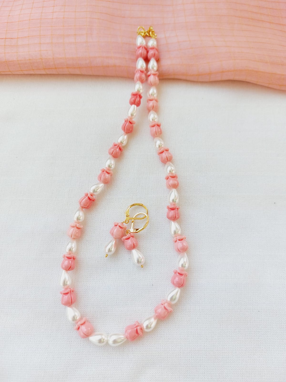 Rose Shaped Beads and Pearl Set (Pink) - A delicate necklace with pink rose-shaped beads and lustrous pearls, crafted by Mugdha Jewellery Store.