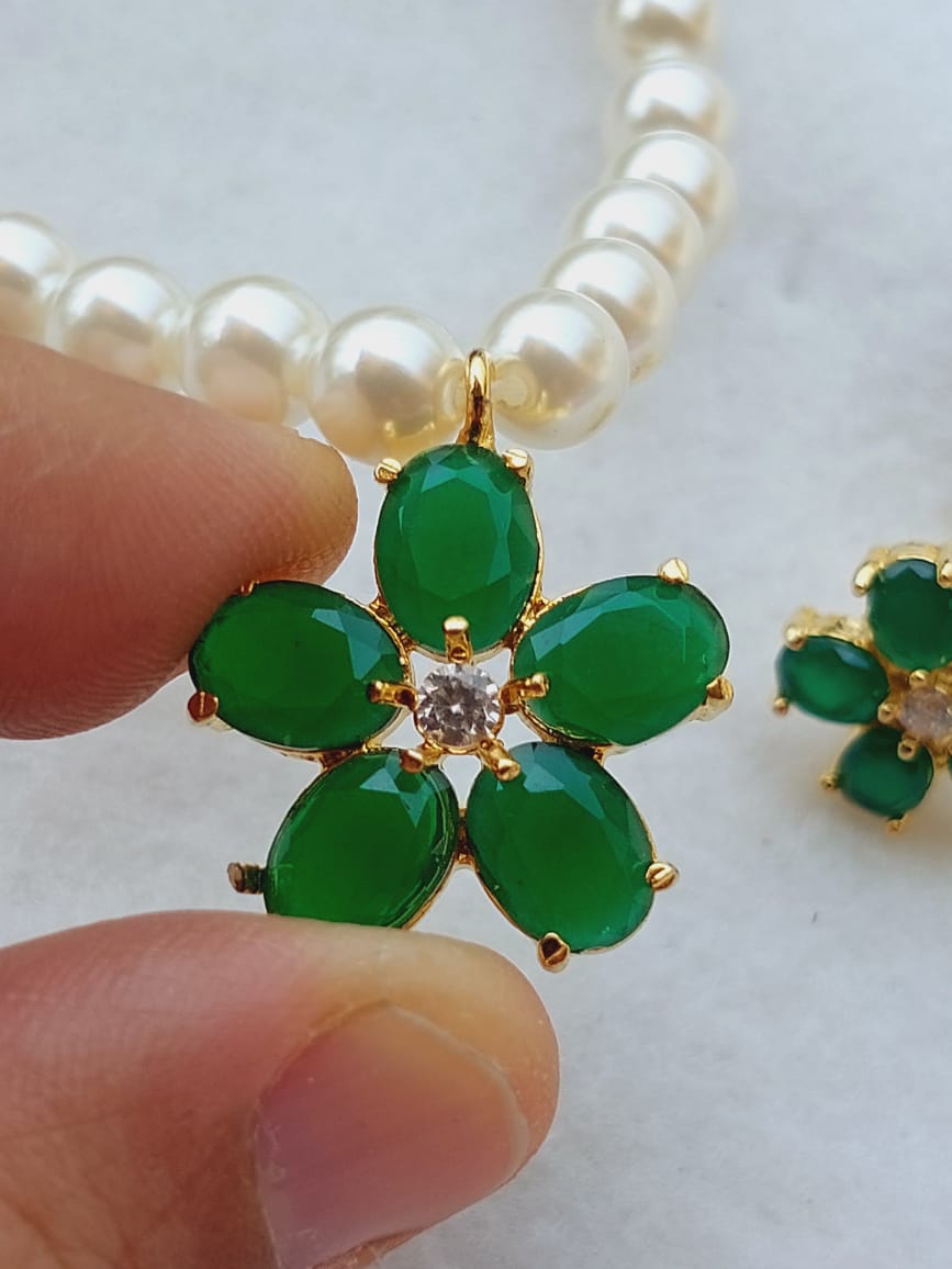 Elegant green flower pearl set from Mugdha Jewellery Store, featuring delicate floral design with sparkling embellishments.