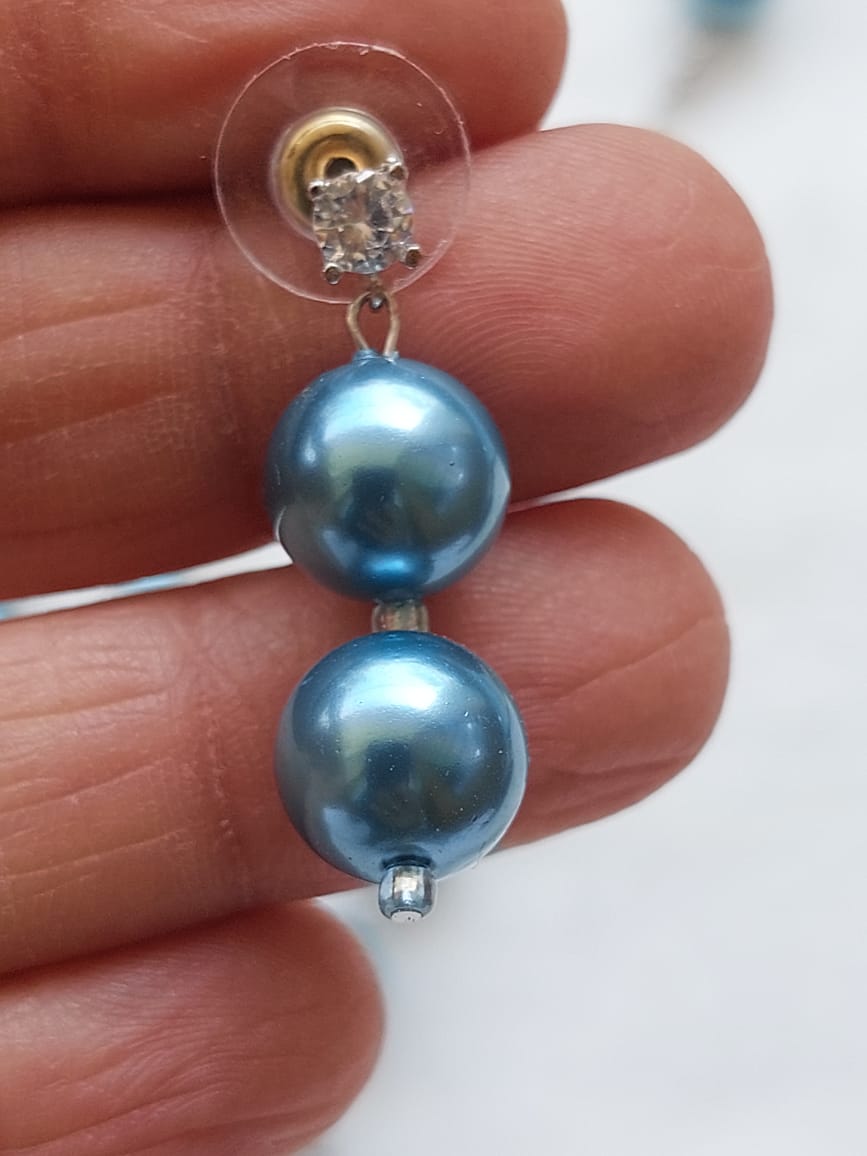 Elegant pearl earrings with shimmering blue pearls and sparkling diamond-like accents