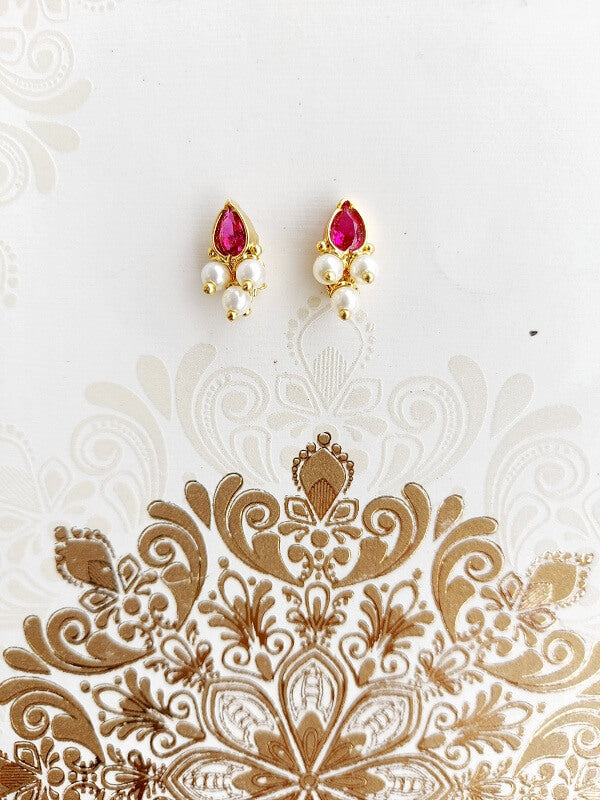 Elegant pink stone karwari draksha small earrings on a decorative white background