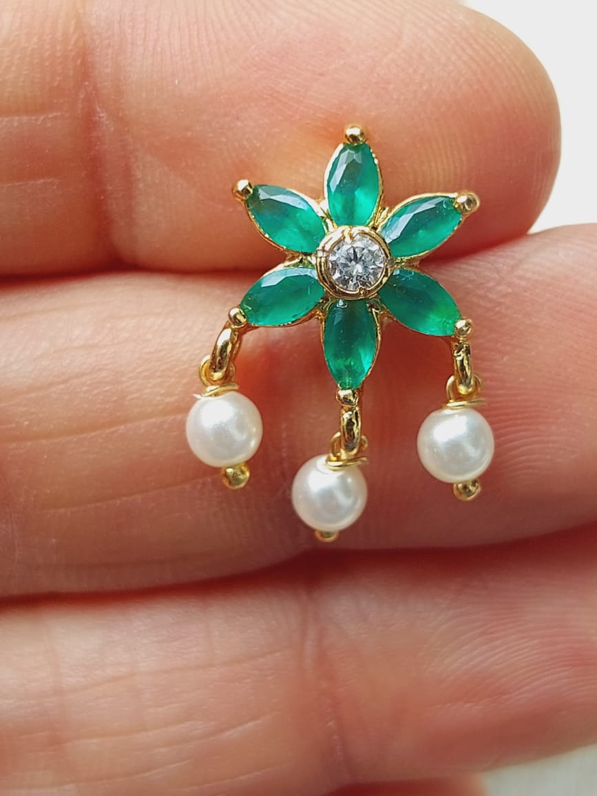 Elegant green stone flower stud earrings with pearl accents from Mugdha Jewellery Store