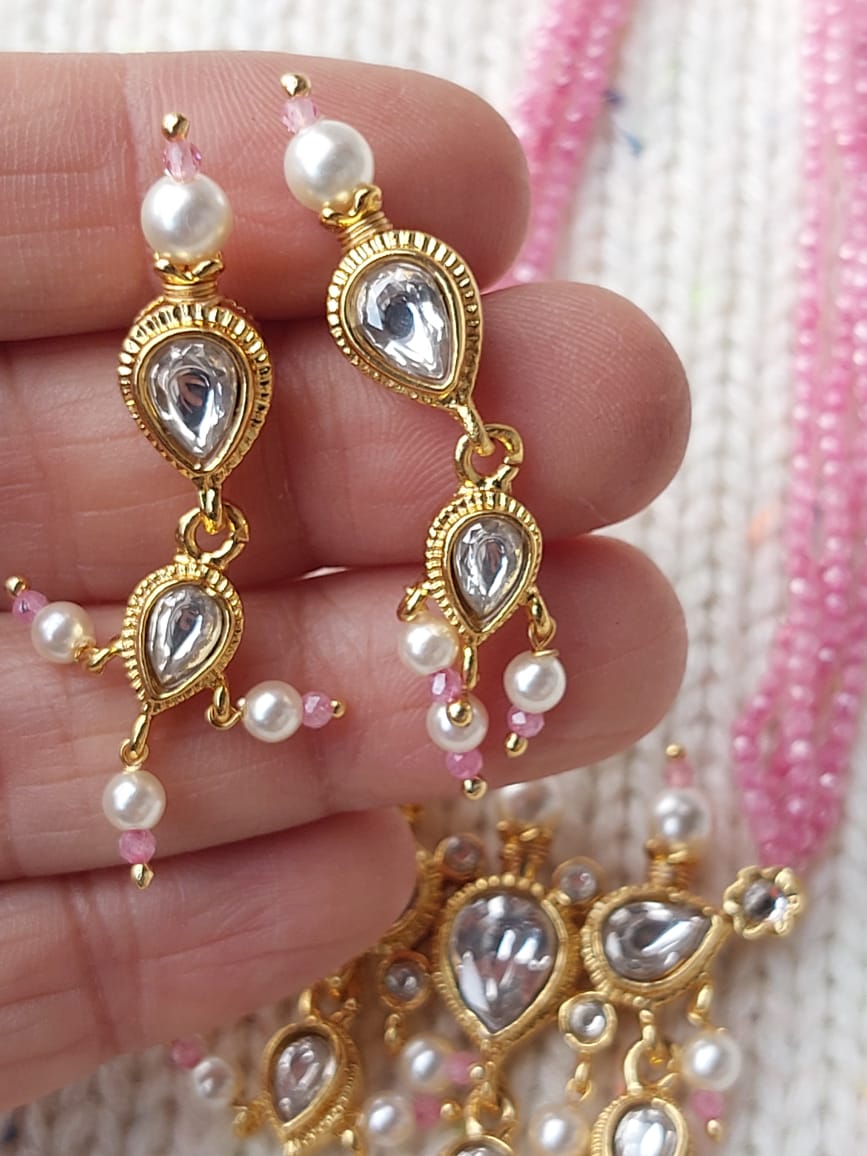 Elegant pearl and crystal drop earrings from Mugdha Jewellery Store's Premium Tanmani Collection, featuring a delicate white tanmani design with baby pink crystals.