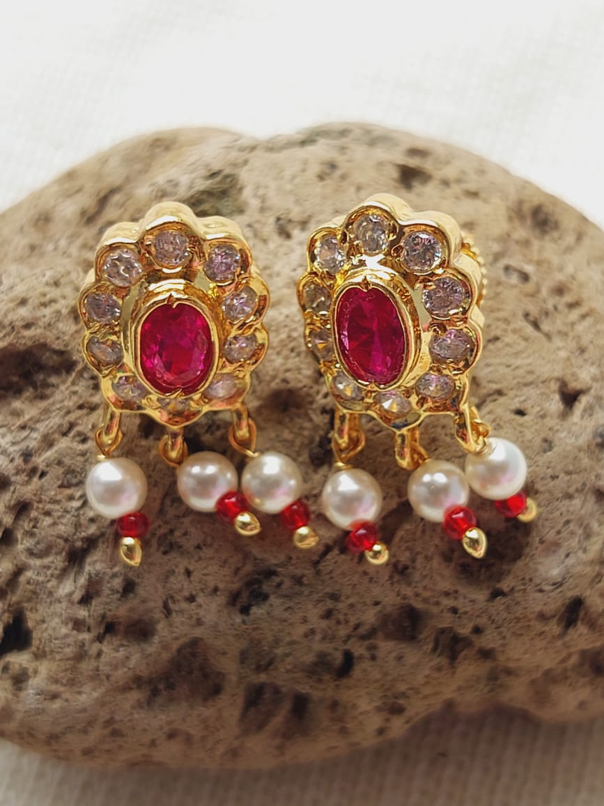 Elegant ruby and pearl studded gold-plated Chandrakor Peacock Pendant Tanmani from Mugdha Jewellery Store.