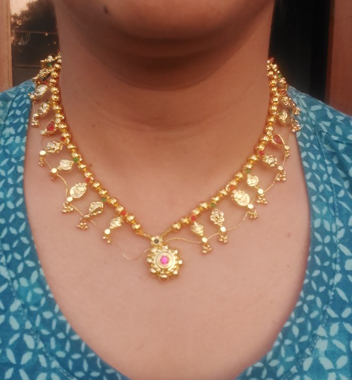 Multicolored golden bead short necklace with ornate pendant from the Mugdha Jewellery Store