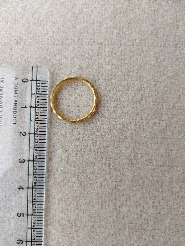 Elegant Gold Toe Ring - Simple yet stylish traditional single layer toe ring from Mugdha Jewellery Store, featured on a ruler for scale.