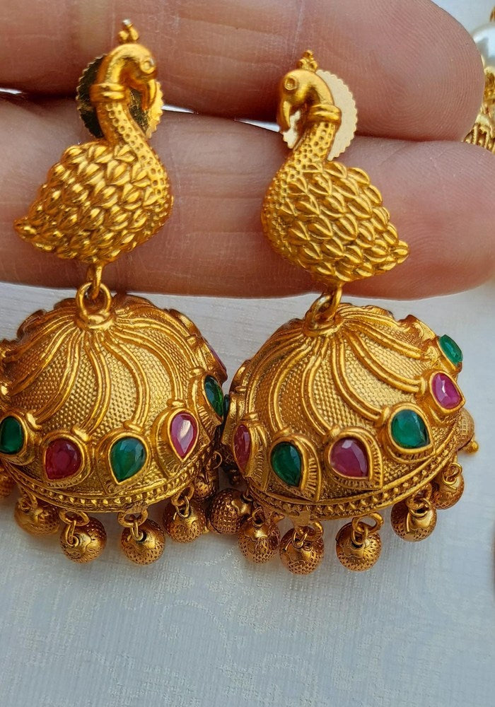 Exquisite Dancing Peacock Pendant Temple Jewellery Set from Mugdha Jewellery Store, featuring intricate golden filigree work and vibrant gemstone accents.