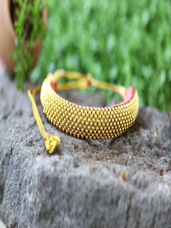 Handmade Rope Bracelet on Wooden Surface