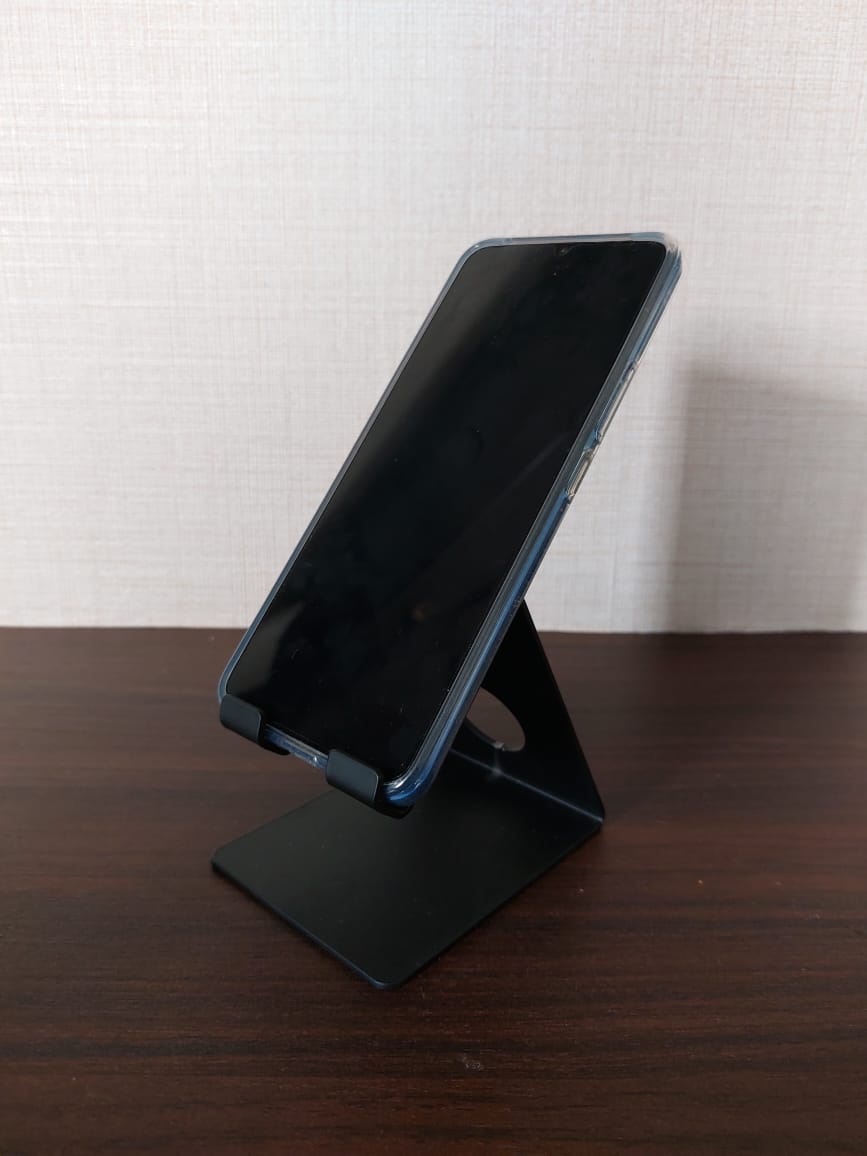 Sturdy mobile holder on wooden table