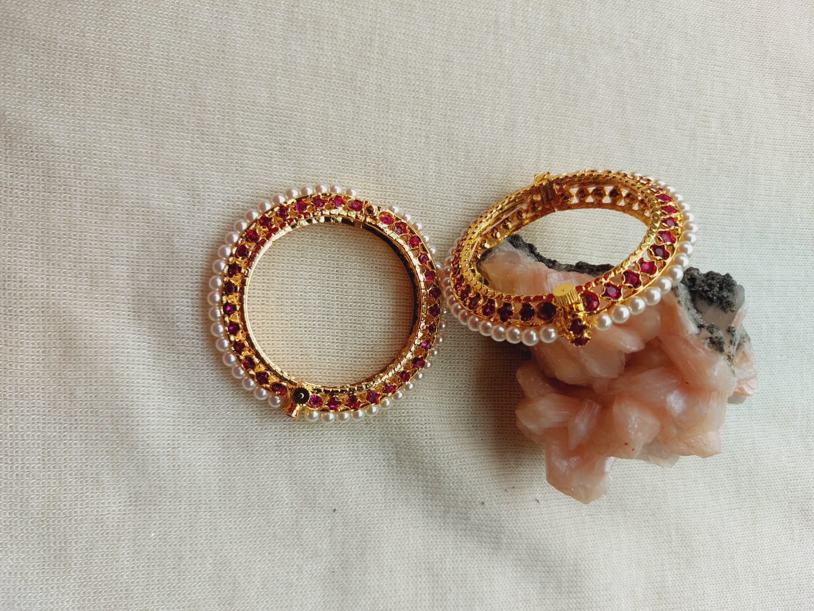 Traditional Moti Tode (For Small Girls) by Mugdha Jewellery Store - Ornate gold-tone Indian jewelry pieces with sparkling red and white accents displayed on a plain background.