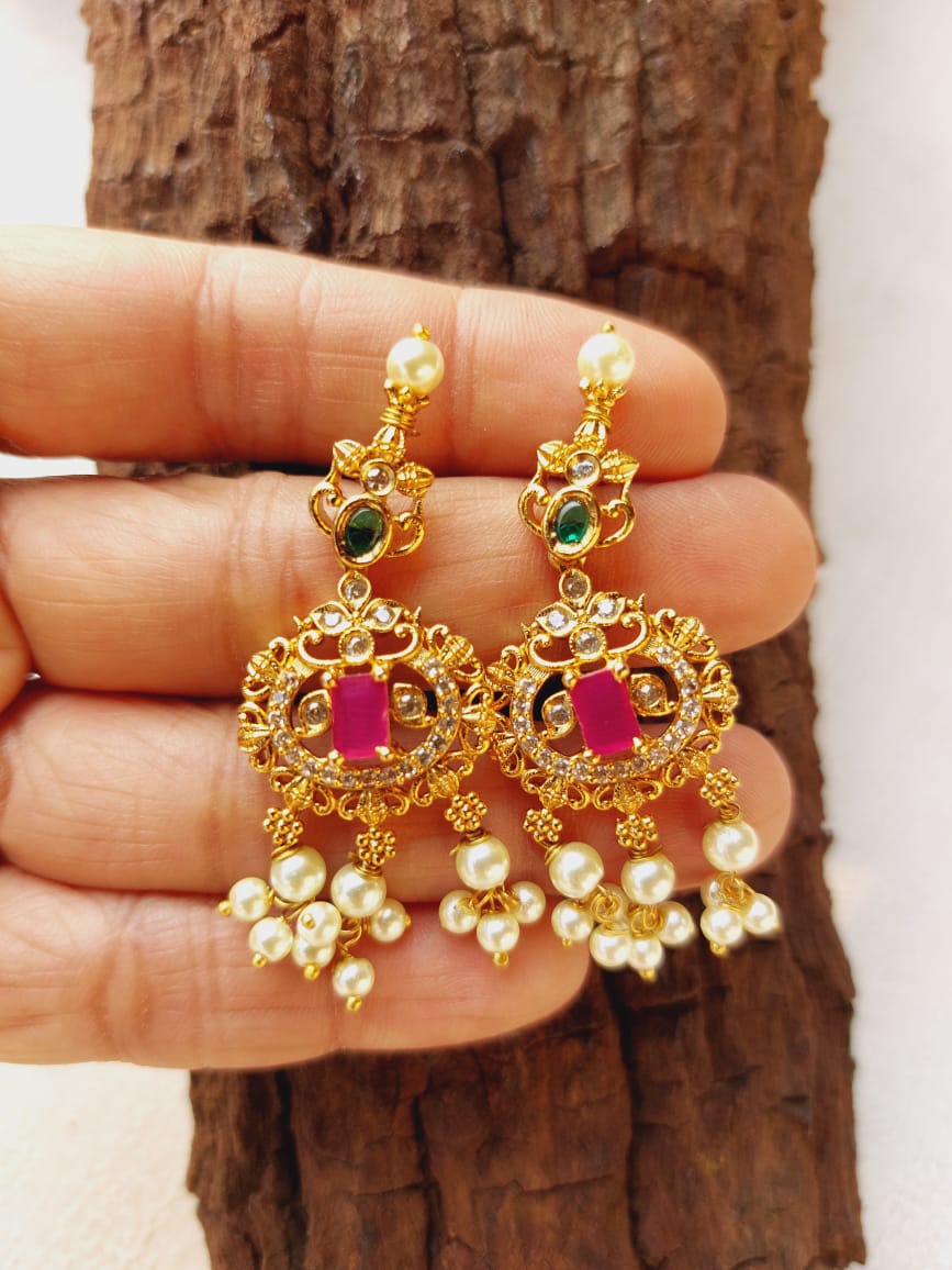 Elegant Gemstone Studded Gold Tone Dangler Earrings from Mugdha Jewellery Store