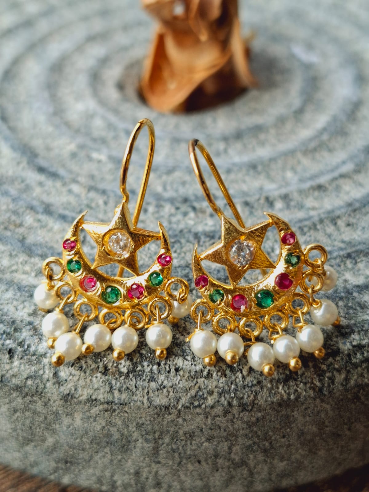 Multicoloured Star Chandrakor Bugdi cum Earrings from Mugdha Jewellery Store. Elegant gold-tone earrings adorned with colorful stones and pearls, creating a stunning and vibrant piece of jewelry.