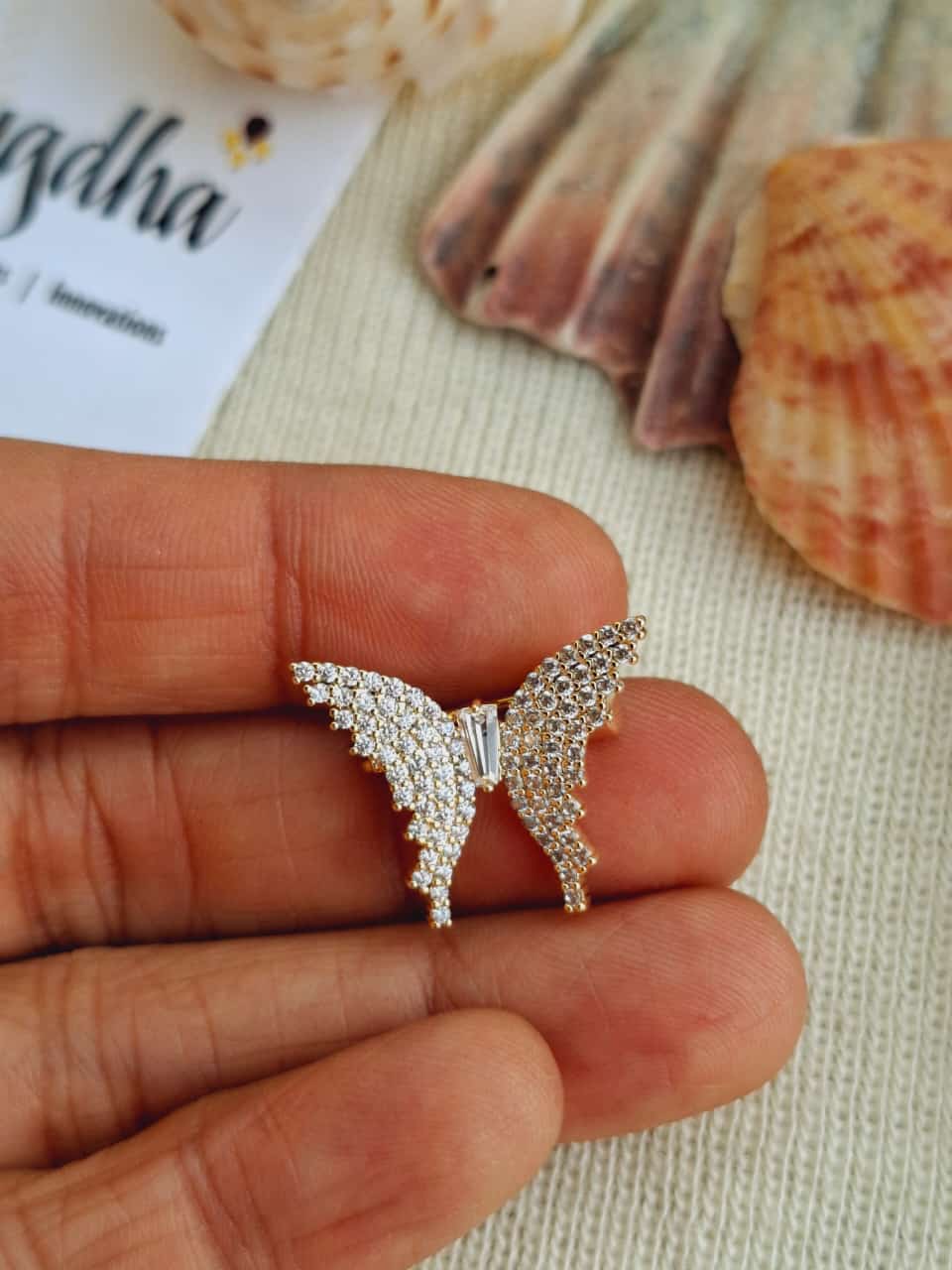 Elegant crystal-encrusted butterfly saree pin from Mugdha Jewellery Store