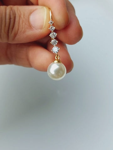 Elegant pearl and diamond danglers from Mugdha Jewellery Store