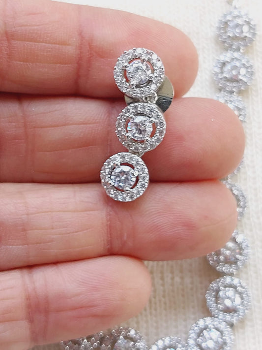 High quality American diamond necklace with intricate design featuring three circular diamond clusters set in silver.