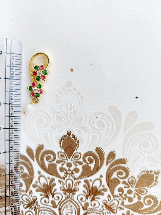 Multicolored Floral Earrings on Ornate White Background