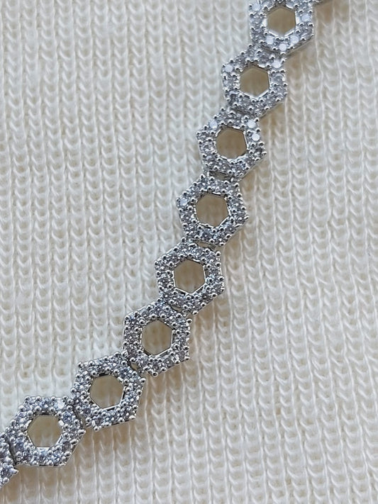 High quality American diamond necklace with a delicate, interlocking hexagon pattern set in silver.
